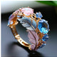  Feather colored diamond ring